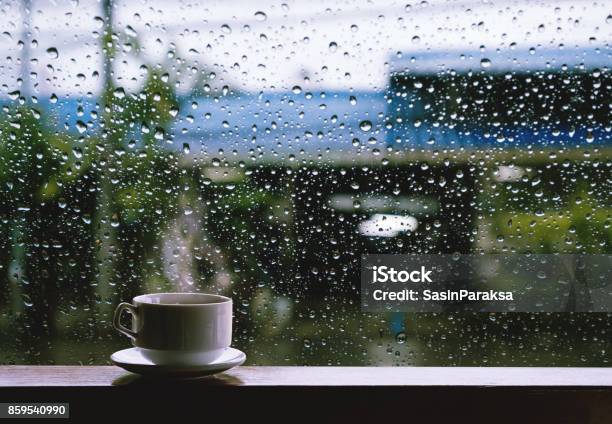 Cup Of Hot Drinks On Wooden Table In Rainy Day Stock Photo - Download Image Now - Rain, Window, Cafe