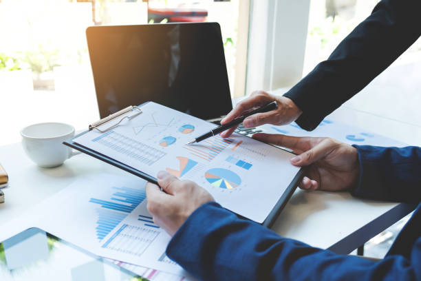 istock Young businessteam working with new startup project. discussing the charts and graphs showing the results at meeting. Business accounting and financial concept 859541028