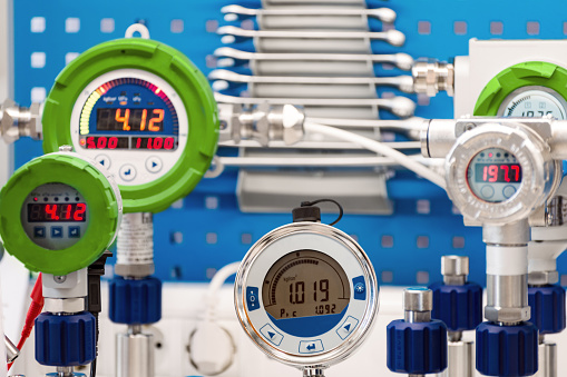 Electronic manometers. Modern instruments for measuring pressure. Abstract industrial background.