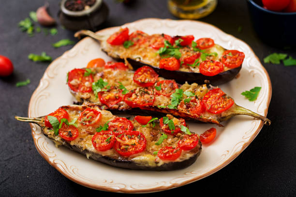 istock Baked eggplants with mozzarella and tomatoes with Italian herbs 859547594