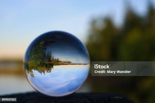 Scenic Lake Reflecting Through A Lens Ball Stock Photo - Download Image Now - Globe - Navigational Equipment, Forest, Contemplation