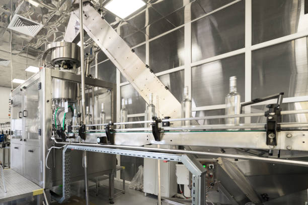 istock Distillery. Line for filling and capping bottles 859551518