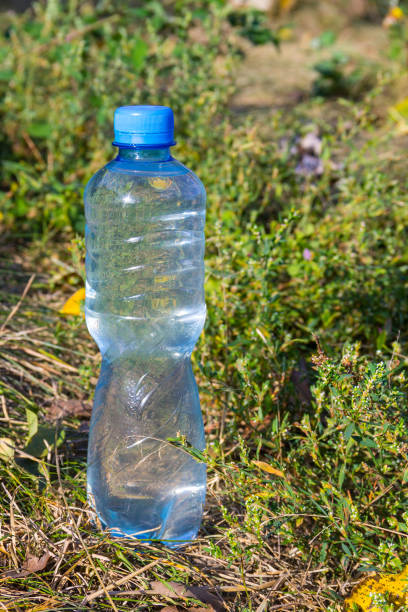 istock Plastic bottle of drinking water on the ground 859554384