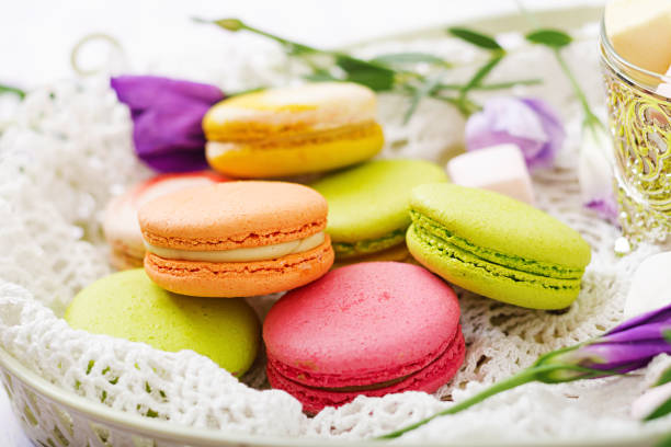 istock Colorful macaroons and marshmallows on a ligth  background. 859555170