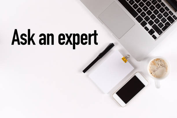 istock Ask an expert text on the desk with copy space 859561956