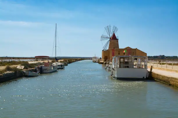 Sea saltworks, salt wind mills are seen in suburbs of Marsala, Sicily, Italy.
