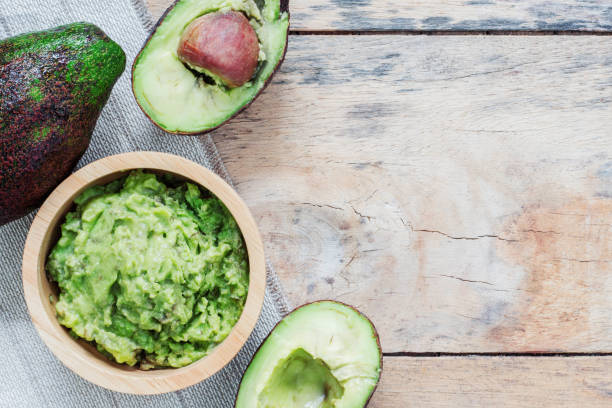 istock Avocado on wooden floor. 859564814
