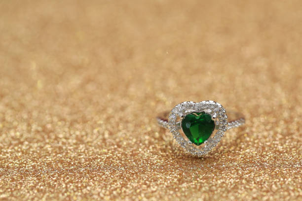 istock Heart green gemstone on diamond ring 859567422