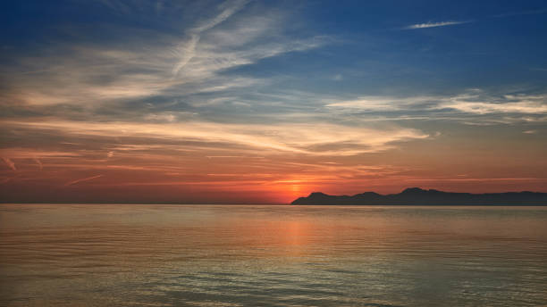 istock Colorful orange marine sunset over a calm ocean 859570554