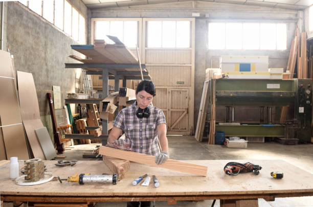 istock a woman working in a carpentry workshop 859571918