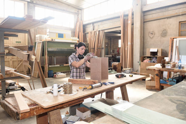 istock a woman working in a carpentry workshop 859572022