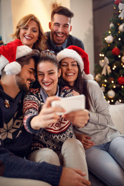 istock Group of young people making Christmas selfie 859580572