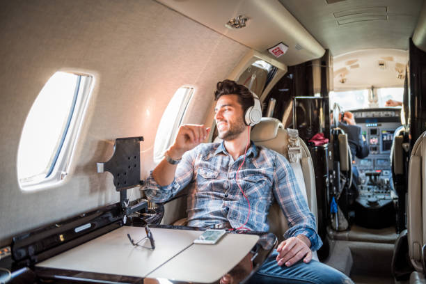 istock Man in private jet airplane 859583490
