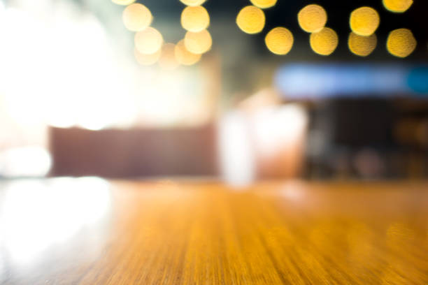 istock Empty wood table with blur in coffee shop or cafe background.For montage product display. 859587334