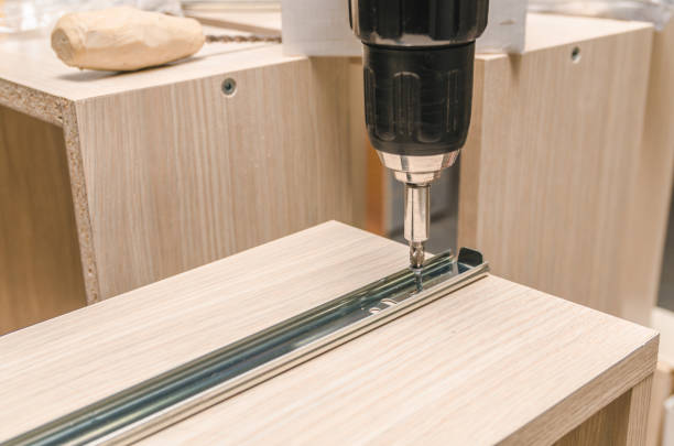 istock Assembling of furniture closeup 859587622