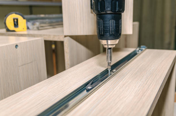 istock Assembling of furniture closeup 859587626