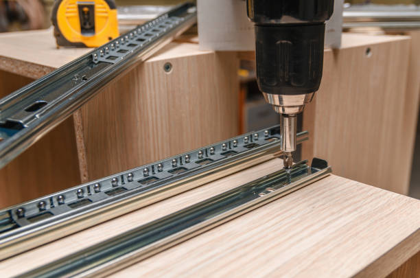 istock Assembling of furniture closeup 859587632