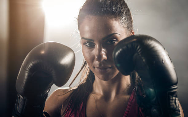 istock Portrait of determined female boxer looking at camera. 859591182