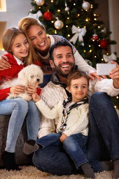 istock Cheerful family making selfie for Christmas 859600568