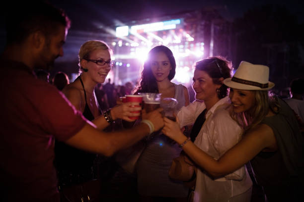 istock Fans at concert toasting with beer 859603344