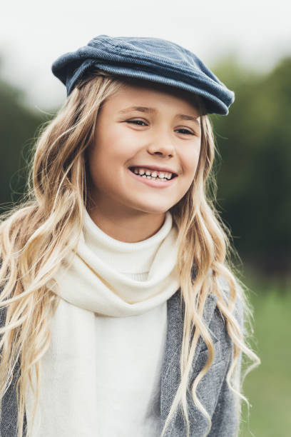 istock child sitting on fence at countryside 859603818