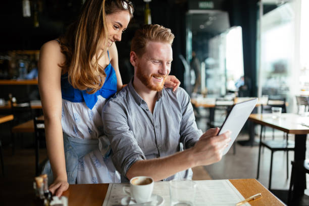 istock Woman and man flirting in cafe 859604180