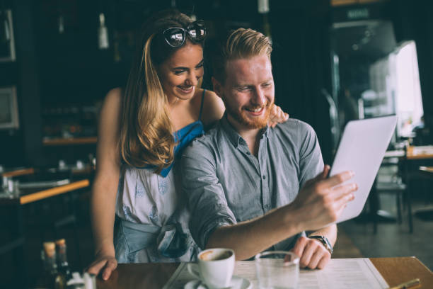 istock Woman and man flirting in cafe 859604206