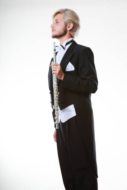 istock Male flutist wearing tailcoat holds flute 859608212
