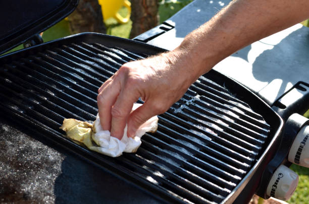 Cleaning the outdoor grill stock photo