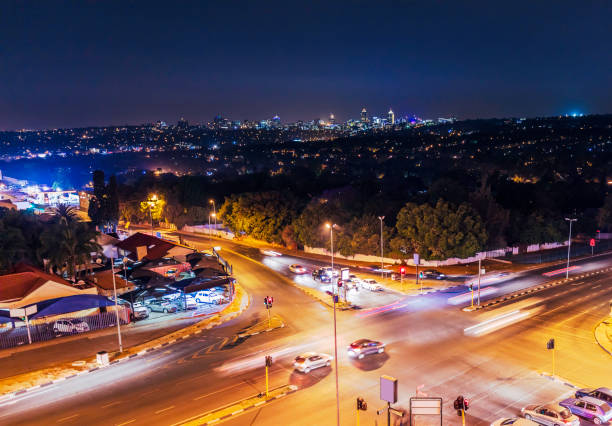 Sandton City in the distance with a main traffic road intersection in Randburg.