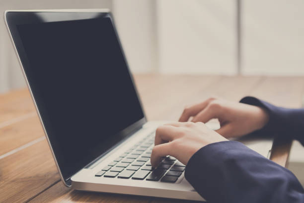 istock Business woman using laptop at workplace, close-up 859611920