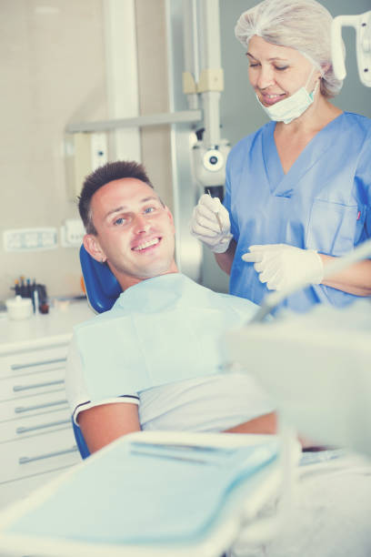 istock Man in dental chair waiting for examination 859616162