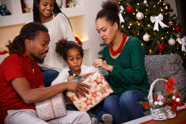 istock Girl looking Christmas gifts 859616254