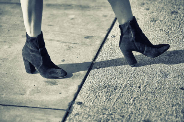 istock Fashionable Boots Woman Walking Close-Up 859619328