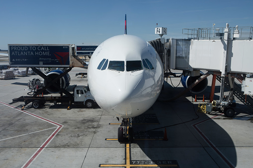 Atlanta, Georgia - October 13, 2016: Delta Airlines passenger airplane is loaded with cargo at Hartsfield-Jackson Atlanta International Airport.