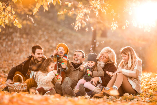 istock Playful multi-generation family having fun on a picnic day. 859622834