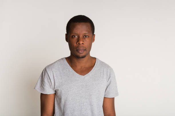 istock Facial expression, emotions, concentrated black man looks straight 859623366