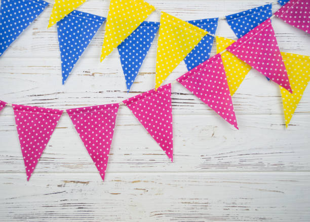 istock garland of yellow, pink and blue flags 859624330