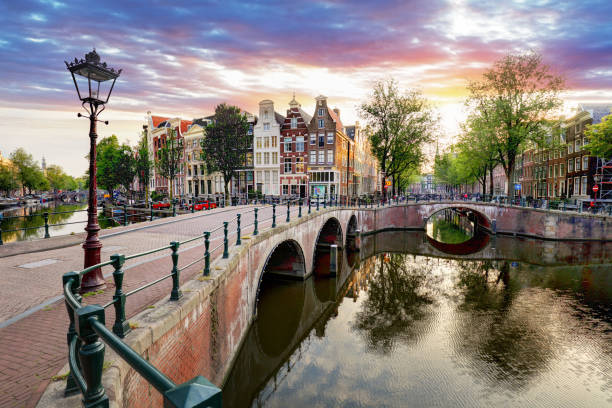 istock Amsterdam Canal houses at sunset reflections, Netherlands 859626674
