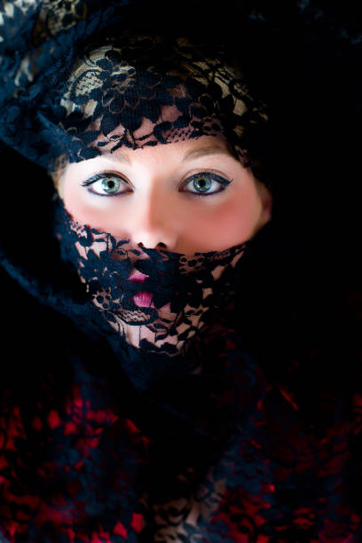 istock Veiled woman with blue eyes 859628022