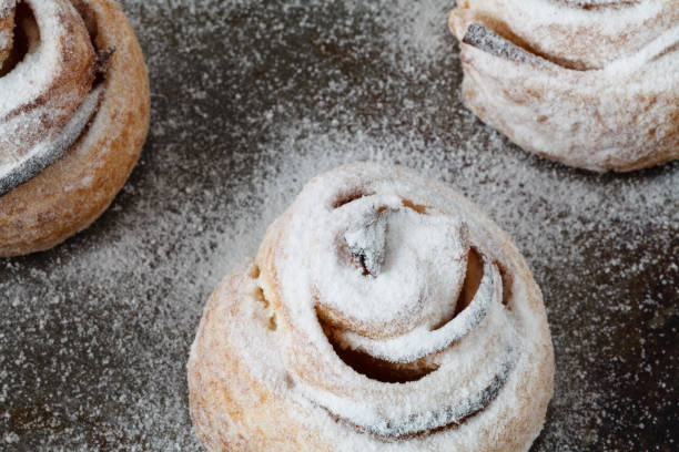 istock Fresh baked cinnamon rolls on steel baking tray 859628122
