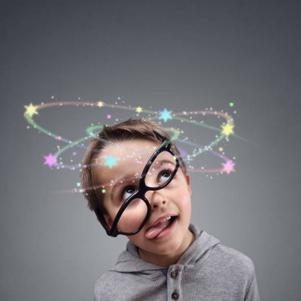 Confused thinking or knocked out boy seeing spinning stars