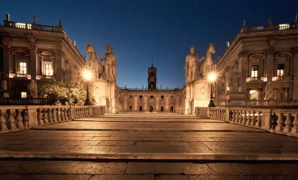 Cordonata Capitolina staircase with statues of Castor and Pollux in Piazza del Campidoglio (Capitoline Square) on the Capitoline Hill, Rome, Italy, at night