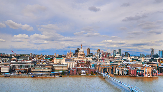 daytime view of St. Paul's Cathedral and the Millenium bridge (London, England).