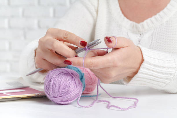 istock Leisure hobby concept, clew of natural wool on table 859635530