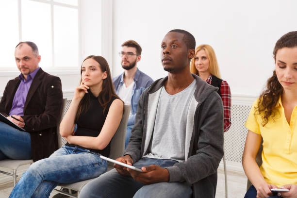 istock Group of people sitting at seminar, copy space 859638902