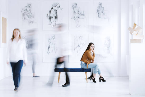 istock Woman looking at sculpture 859639012