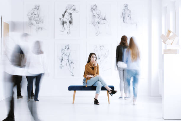 istock Tourist woman visiting art gallery 859639022