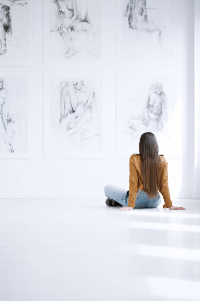 istock Woman looking at drawing collection 859639030