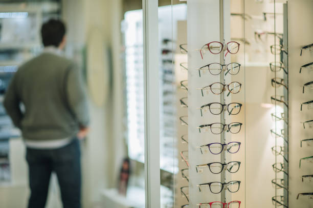 istock Large group of different eyeglasses at optician store. 859643108